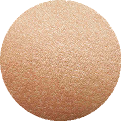 Un cercle montrant en gros plan une peau à la texture régulière et équilibrée.